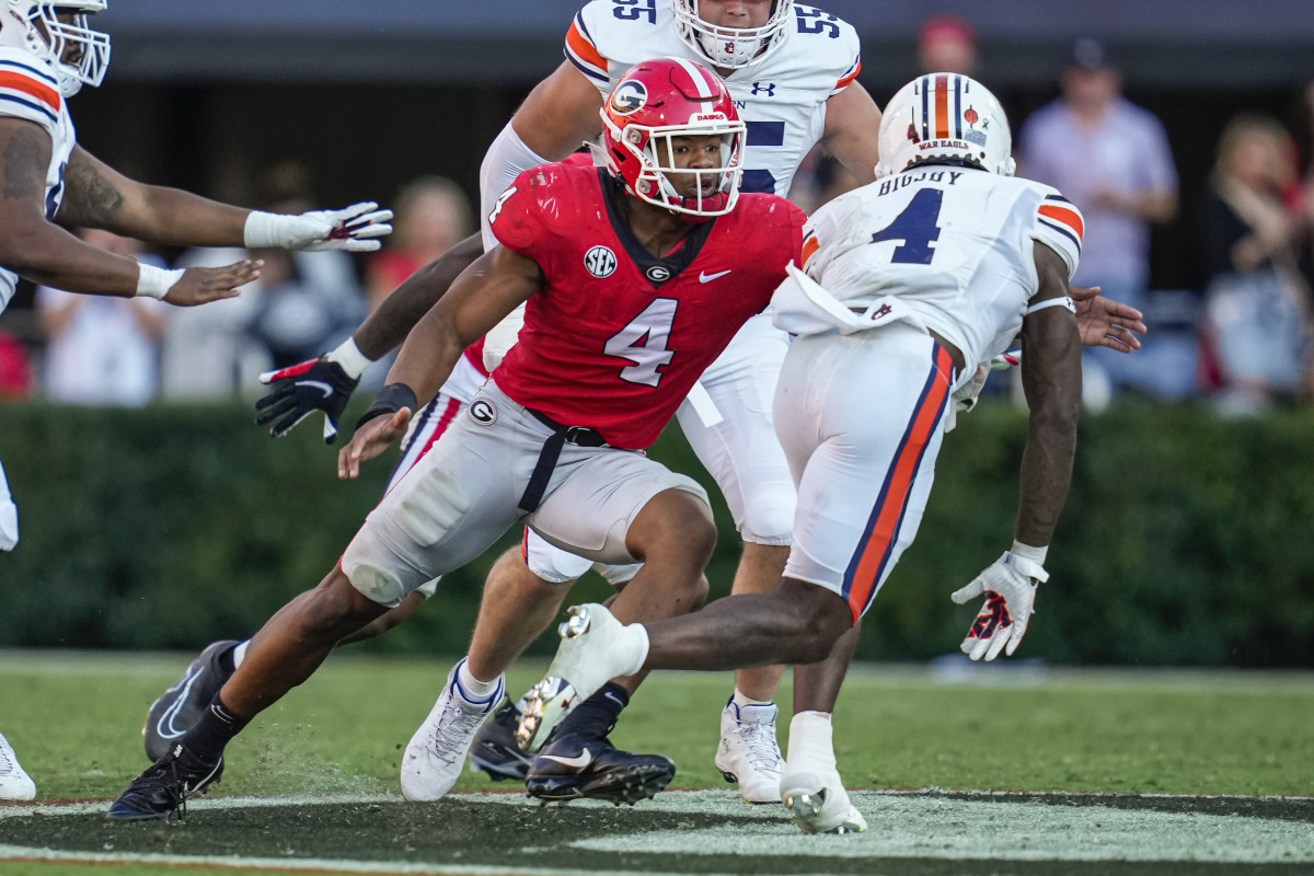 Oct 8, 2022; Athens, Georgia, USA; Georgia Bulldogs linebacker Nolan Smith (4) tackles Auburn Tigers running back Tank Bigsby (4) at Sanford Stadium.